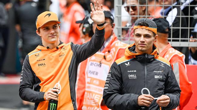 McLaren's Australian driver Oscar Piastri (left) and teammate Lando Norris arrive ahead of the race. (Photo by PEDRO PARDO / AFP)