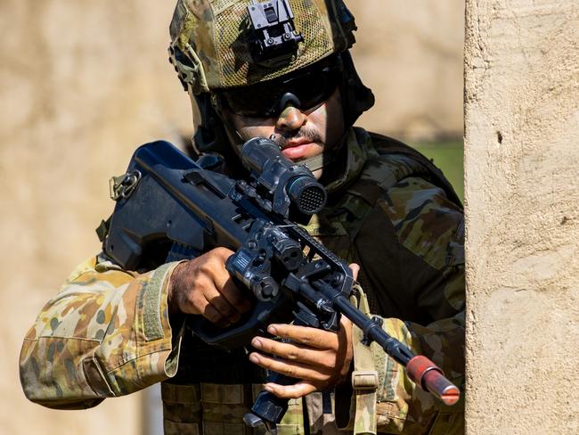 Exercise Silicon Brolga at Townsville Field Training Area at High Range. An Australian Army soldier from the 3rd Combat Engineer Regiment, clears a compound during an explosive urban breaching serial at Townsville Field Training Area, Queensland. Picture: Defence Media.