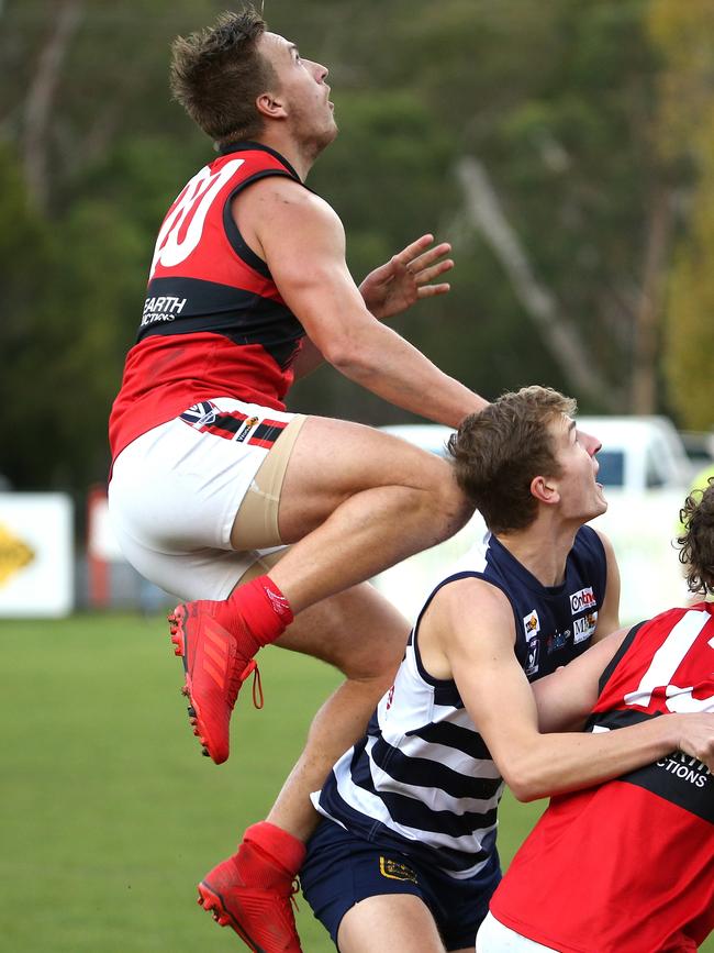 Ayden Tessari flies high for Romsey. Picture: Hamish Blair