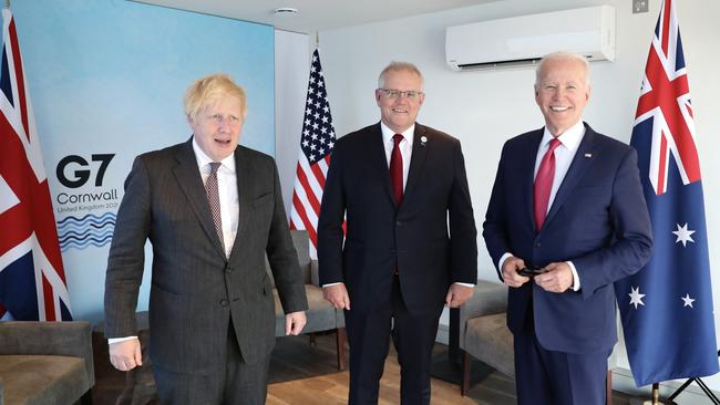 Scott Morrison’s first in-person meeting with Joe Biden in Cornwall was upgraded to include Boris Johnson, bringing together the wartime allies in a strong message to China. Picture: Adam Taylor/PMO