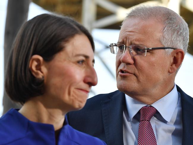 Prime Minister Scott Morrison (right) with New South Wales Premier Gladys Berejiklian (left) during a visit to St. Mary's train station in Sydney, Monday, March 11, 2019. NSW voters will go to the polls on March 23 for the state election. (AAP Image/Dean Lewins) NO ARCHIVING