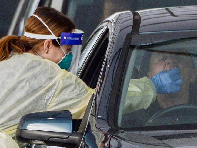 ADELAIDE, AUSTRALIA - NewsWire Photos JULY 01, 2021 -  Lines of cars and health workers at the Victoria Park Covid testing clinic in Adelaide. Picture: NCA NewsWire / Brenton Edwards