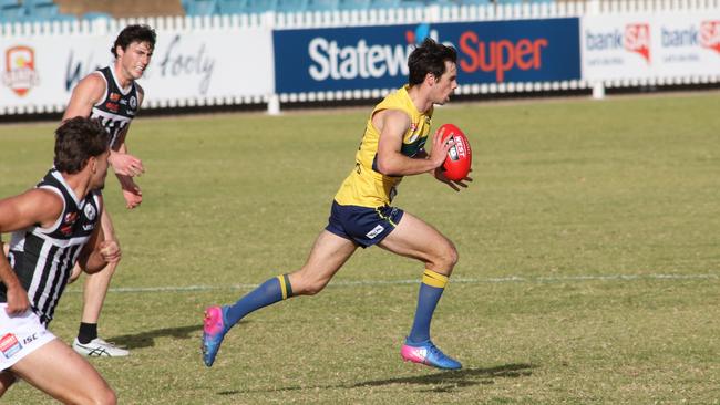 Chris Hall made his 150th league appearance for the Eagles and celebrated by going to the top of the ladder. Picture: Russell Millard/AAP