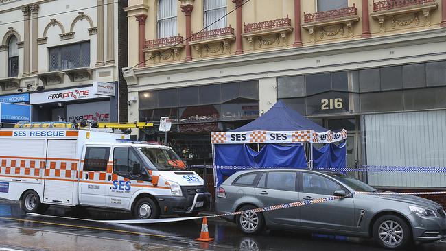 Police and emergency services at the scene where Mr Boursinos died in Elsternwick. Picture: Ian Currie