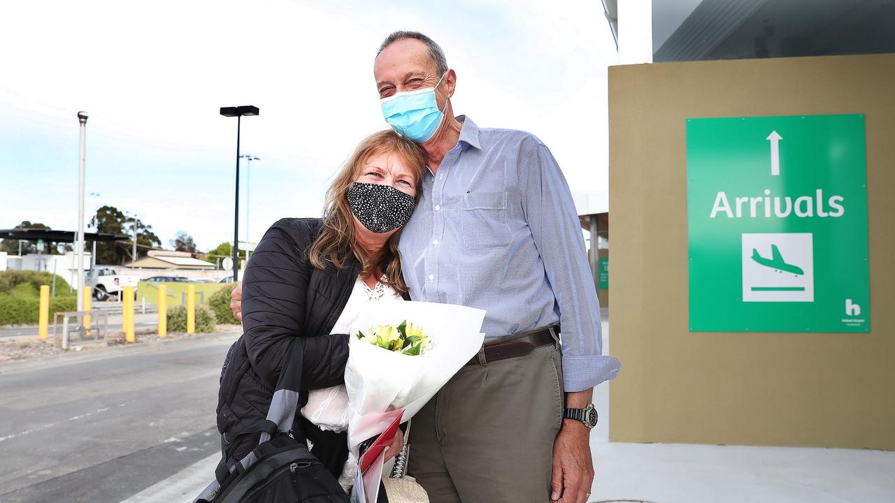 Colin Lester hugging wife Mairi Lester who arrived home. Tasmanian borders open to high risk states once again. Picture: Nikki Davis-Jones