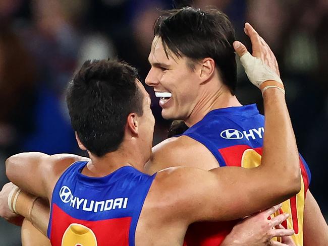 MELBOURNE, AUSTRALIA - JUNE 07: Eric Hipwood of the Lions is congratulated by team mates after kicking a goal during the round 13 AFL match between Western Bulldogs and Brisbane Lions at Marvel Stadium, on June 07, 2024, in Melbourne, Australia. (Photo by Quinn Rooney/Getty Images)