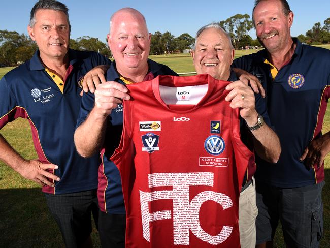 Tyabb coach Mark Paganoni (left), original coach Ron Pickersgill, original president Geoff Stockton and current president Doug Taylor with Tyabb Football Club's heritage round jumper. Picture: Jason Sammon