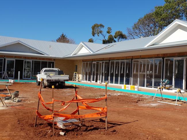 Developer Harold Crane's new shopping precinct in Highfields is nearly complete, with three tenancies filled already.