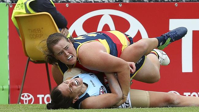 Sarah Perkins lays a crunching tackle on Laura Attard. Picture: Sarah Reed