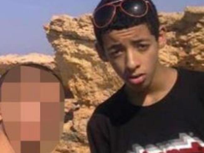 The terrorist is pictured on the beach as a teen in Libya.