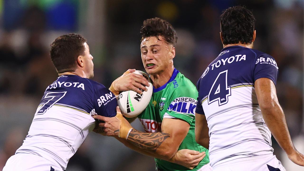 CANBERRA, AUSTRALIA - APRIL 14: Charnze Nicoll-Klokstad of the Raiders is tackled during the round six NRL match between the Canberra Raiders and the North Queensland Cowboys at GIO Stadium on April 14, 2022, in Canberra, Australia. (Photo by Mark Nolan/Getty Images)