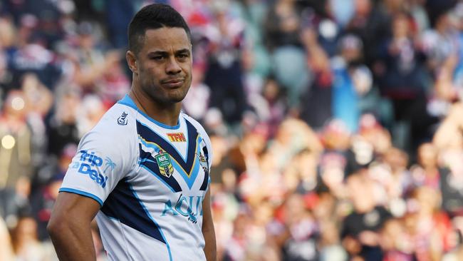 Jarryd Hayne of the Titans gestures after accidentally kicking the ball into touch which then allowed the Roosters to get possession, score and win the game during the NRL Round 26 rugby league match between the Sydney Roosters and Gold Coast Titans at the Allianz Stadium in Sydney, Saturday, September 2, 2017. (AAP Image/David Moir) NO ARCHIVING, EDITORIAL USE ONLY