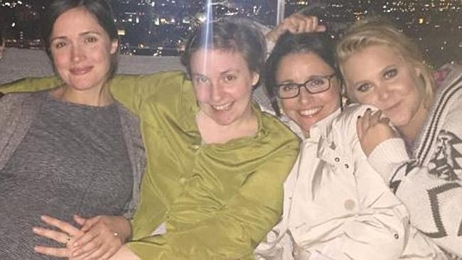 Rose shows baby bump on girls night