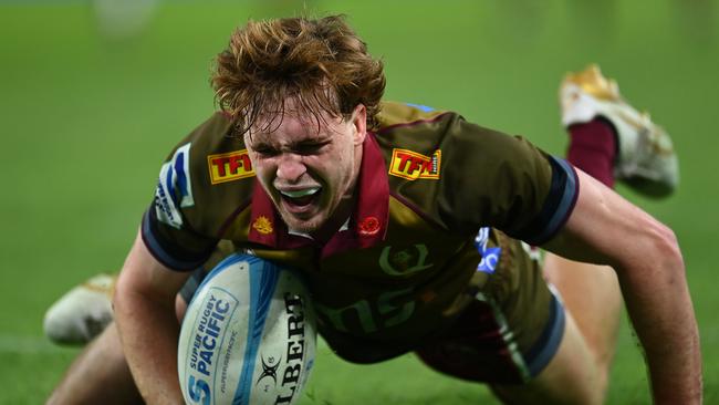 Tim Ryan celebrates after scoring a try for the Reds last season. Picture: Albert Perez/Getty Images