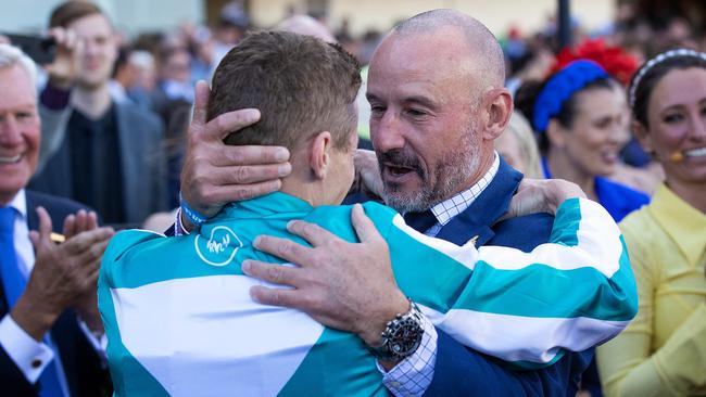 Twelve months after their 2022 Cox Plate embrace, James McDonald and Glen Boss again celebrate after Romantic Warrior’s famous 2023 Cox Plate victory. Picture: Mark Stewart