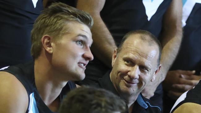 Ken Hinkley talks to his new co-captain Ollie Wines. Picture Sarah Reed