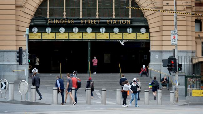 Melburnians slowly return to the city as restrictions begin to ease. Picture: Andrew Henshaw