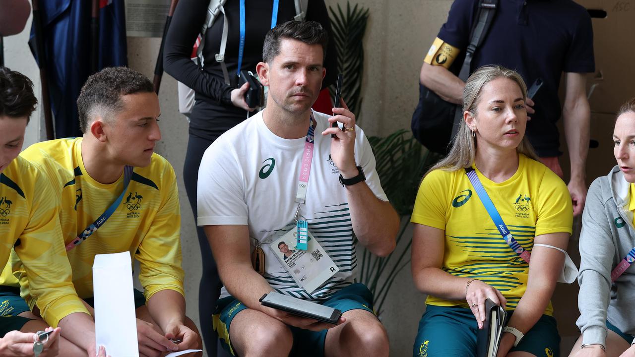 Eamon Sullivan addresses the Dolphins swim team at the Olympic Village. Picture: Adam Head