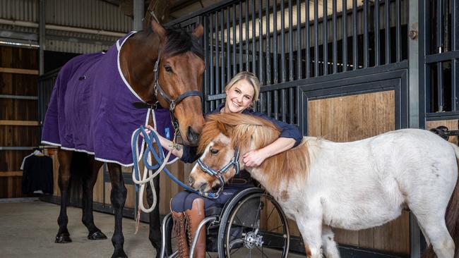 Australian Paralympic equestrian and VRC ambassador Emma Booth with her retired racehorse Big Ben and pony Pedro at her Langwarrin South stables. Picture: Jake Nowakowski