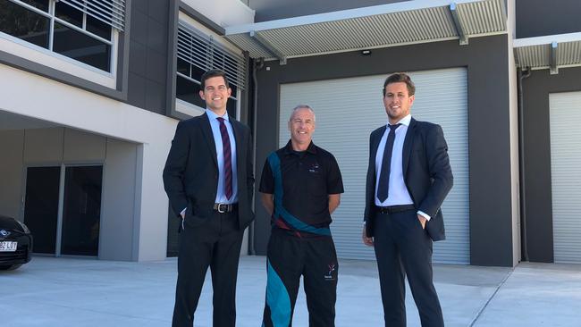 Cushman &amp; Wakefield's Dave Kertesz and Sean O'Connor flank Paul Needham of the Varsity Lakes Trampoline &amp; Gymnastics Club