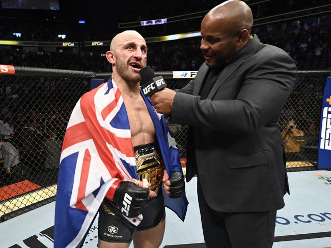 Alex Volkanovski already rates as one of the best fighters of all time, says UFC legend Daniel Cormier (right). Picture: Jeff Bottari/Zuffa LLC