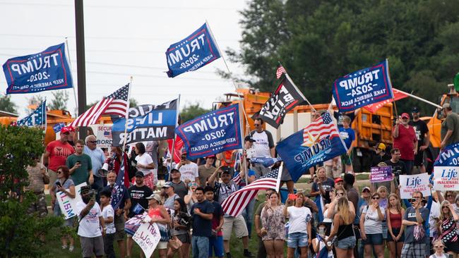 Supporters of former President Donald Trump protest President Joe Biden during his visit to McHenry County College in Crystal Lake. Picture: Getty