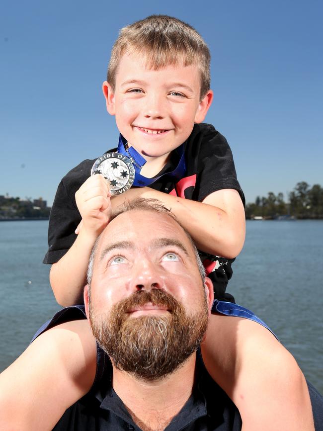 Maike Hohnen and his son Julian, 7. Picture: Steve Pohlner/AAP