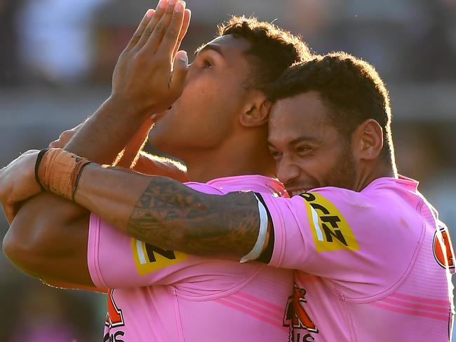 BRISBANE, AUSTRALIA - AUGUST 29:  Tevita Pangai Junior of the Panthers celebrates with Apisai Koroisau of the Panthers after scoring a try during the round 24 NRL match between the Penrith Panthers and the Wests Tigers at Moreton Daily Stadium on August 29, 2021, in Brisbane, Australia. (Photo by Albert Perez/Getty Images)