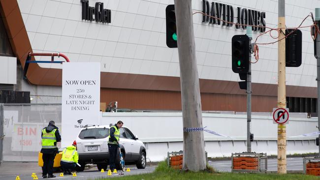 Police investigate the accident on Springvale Road, outside The Glen Shopping Centre. Picture: Sarah Matray