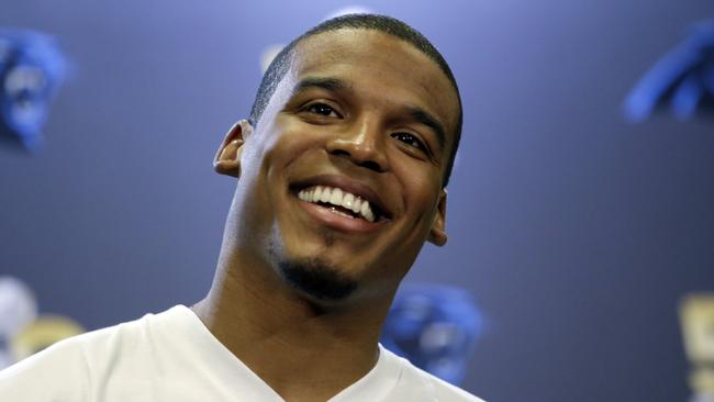 Carolina Panthers quarterback Cam Newton smiles as he answers questions during a press conference Tuesday, Feb. 2, 2016 in San Jose, Calif. Carolina plays the Denver Broncos in the NFL Super Bowl 50 football game Sunday, Feb. 7, 2015, in Santa Clara, Calif. (AP Photo/Marcio Jose Sanchez)