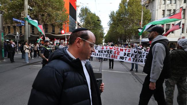 Once our national symbols were themselves nationally unifying, paid respect and in a sense neutral. Pro-Palestine protesters are pictured in Melbourne on Anzac Day. Picture: David Caird