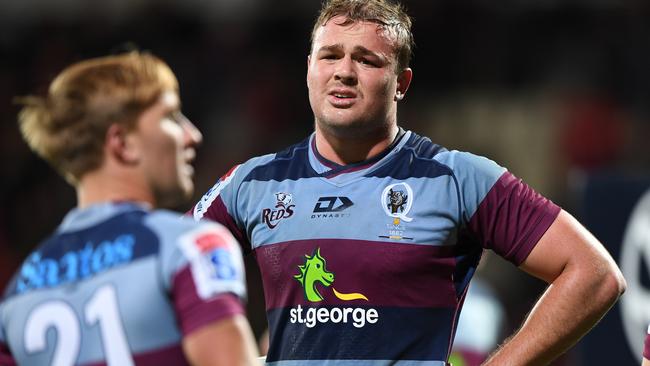 CHRISTCHURCH, NEW ZEALAND - MARCH 06: JP Smith of the Reds (C) and his team mates look dejected after conceding a try during the round six Super Rugby match between the Crusaders and the Reds at Orangetheory Stadium on March 06, 2020 in Christchurch, New Zealand. (Photo by Kai Schwoerer/Getty Images)