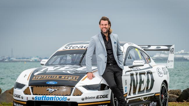 Williams poses alongside the new Ned Whisky race car. Picture: Jake Nowakowski