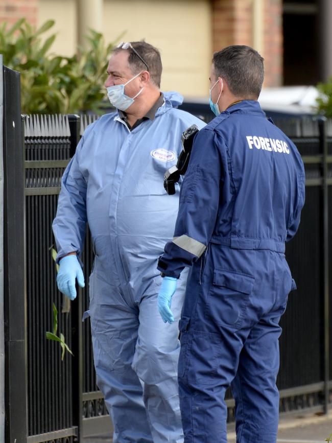 Police investigators on the scene. Picture: Andrew Henshaw