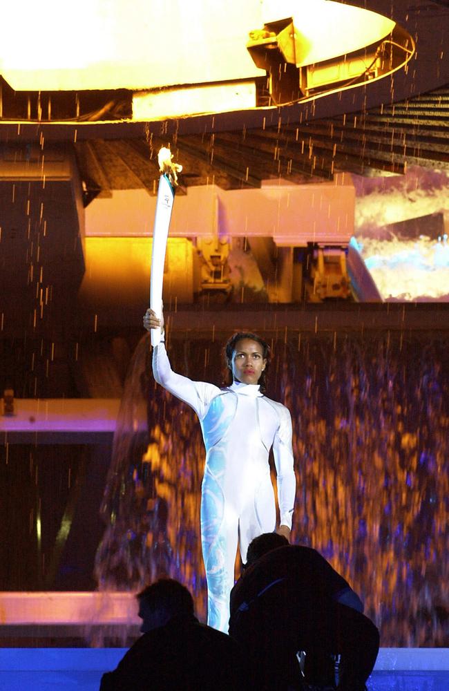 Cathy Freeman after igniting the cauldron with Olympic torch surrounded by water during the Opening Ceremony Sept 15, 2000.