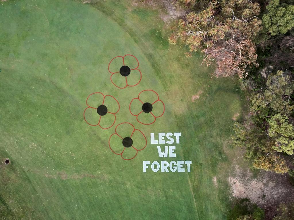 Huge poppies were painted onto Wakehurst Golf Course ahead of Anzac Day. Picture: Will Horner
