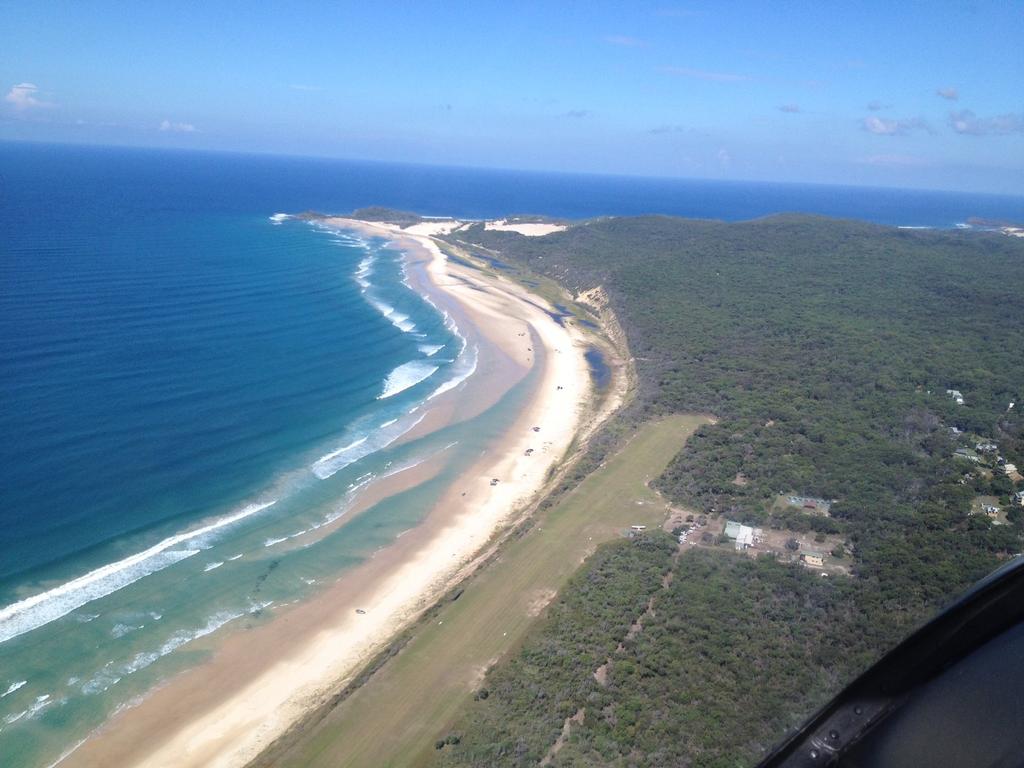 The Bundaberg-based RACQ CareFlight Rescue crew flew to a camp site north of Orchid Beach where a man had fallen 4m from a tree. Photo RACQ CareFlight Rescue