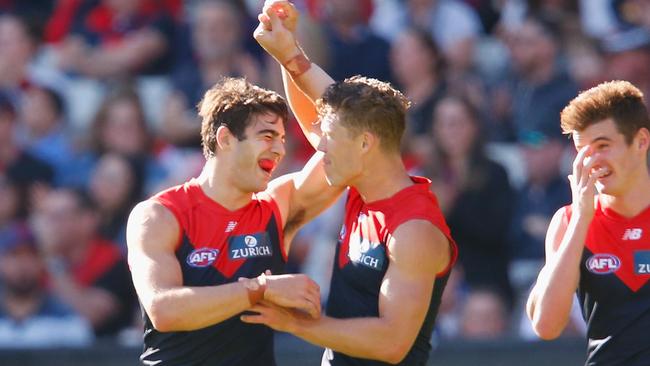 Christian Petracca and Jake Melksham celebrate a goal.