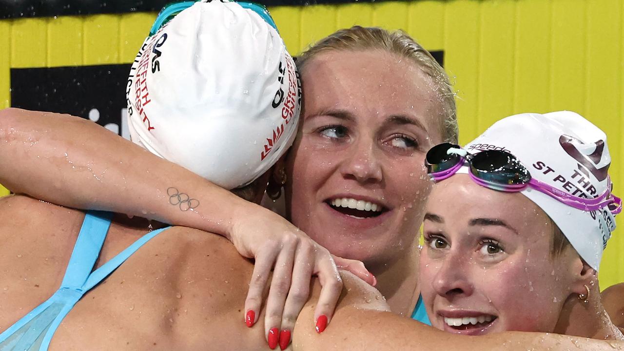 Ariarne Titmus, centre, won the women’s 200m freestyle final in a new world record time during the Australian Swimming Trials at the Brisbane Aquatic Centre on June 12, 2024. Picture: David Gray/AFP