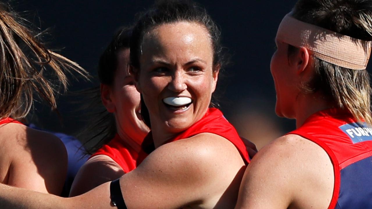 Daisy Pearce celebrates a goal with teammates as the Dees lock in a grand final appearance. Picture: Dylan Burns/AFL Photos via Getty Images