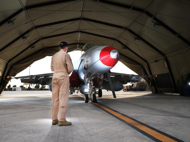 Home base ... a Royal Australian Air Force F/A18F Super Hornet in the Middle East inside a portable hangar. Picture: Gary Ramage