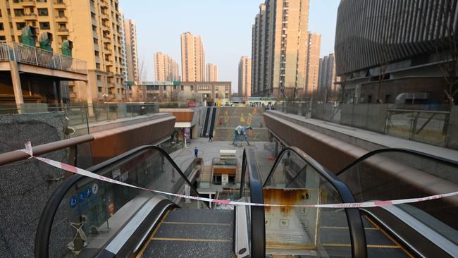 A blocked off escalator is seen at a partially operating Evergrande commercial complex in Beijing on January 29, 2024. Picture: GREG BAKER / AFP