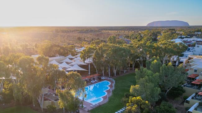 Two firms are jockeying to snare a long term lease over the $380m Indigenous-owned accommodation hubs in the shadow of Uluru.