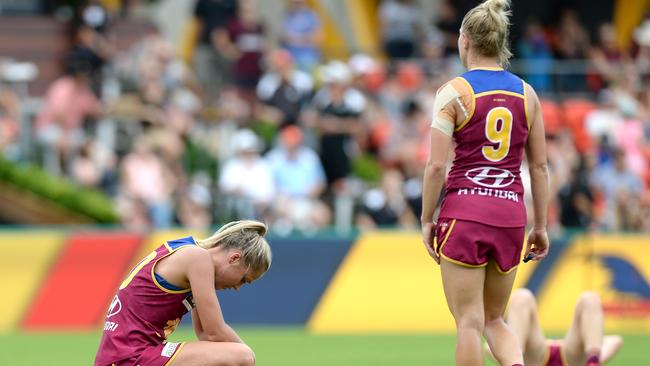 Brisbane players react to their loss. Picture: Bradley Kanaris