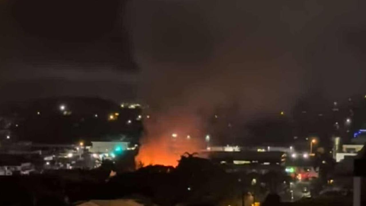 The fire and smoke from an Auckland St, Gladstone house fire that consumed the single-storey home could be seen from afar on December 12, 2024. PIC: Contributed