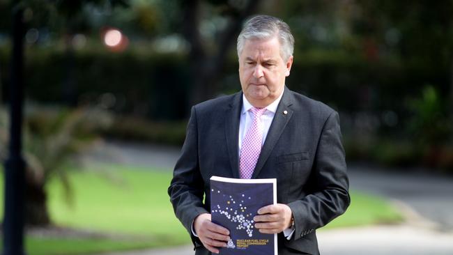 Kevin Scarce handing over the report from The Nuclear Fuel Cycle Royal Commission to South Australian Governor Hieu Van Le at Government House on Friday. Picture: Kelly Barnes/The Australian.