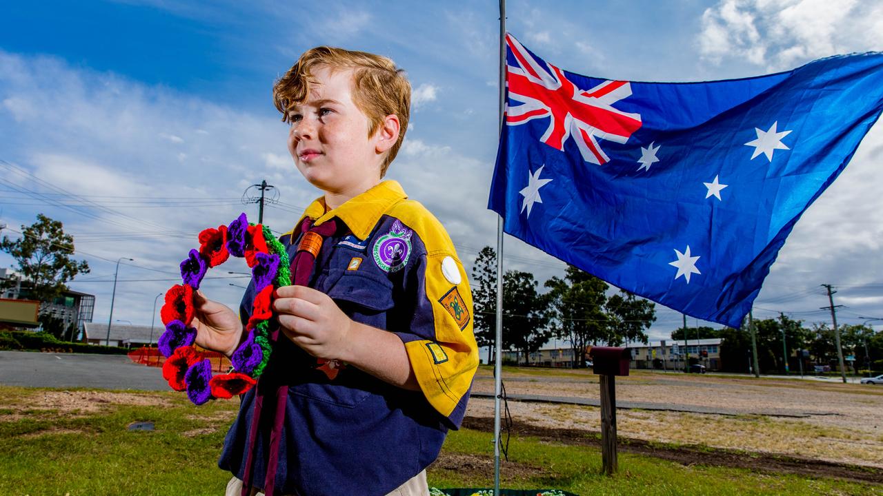 Robert, 8, observed Anzac Day outside his house in Queensland in 2020 after his family built a flagpole for the commemorations. Picture: Richard Walker