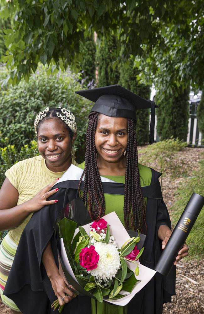 Elly Fafungian congratulates her sister, Yvonne Fafungian, on her Bachelor of Aviation graduation at a UniSQ graduation ceremony at Empire Theatres, Tuesday, February 13, 2024. Picture: Kevin Farmer