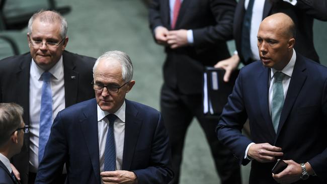 Treasurer Scott Morrison, Prime Minister Malcolm Turnbull and leadership challenger Peter Dutton leave Parliament after a vote to refer Mr Dutton to the High Court.