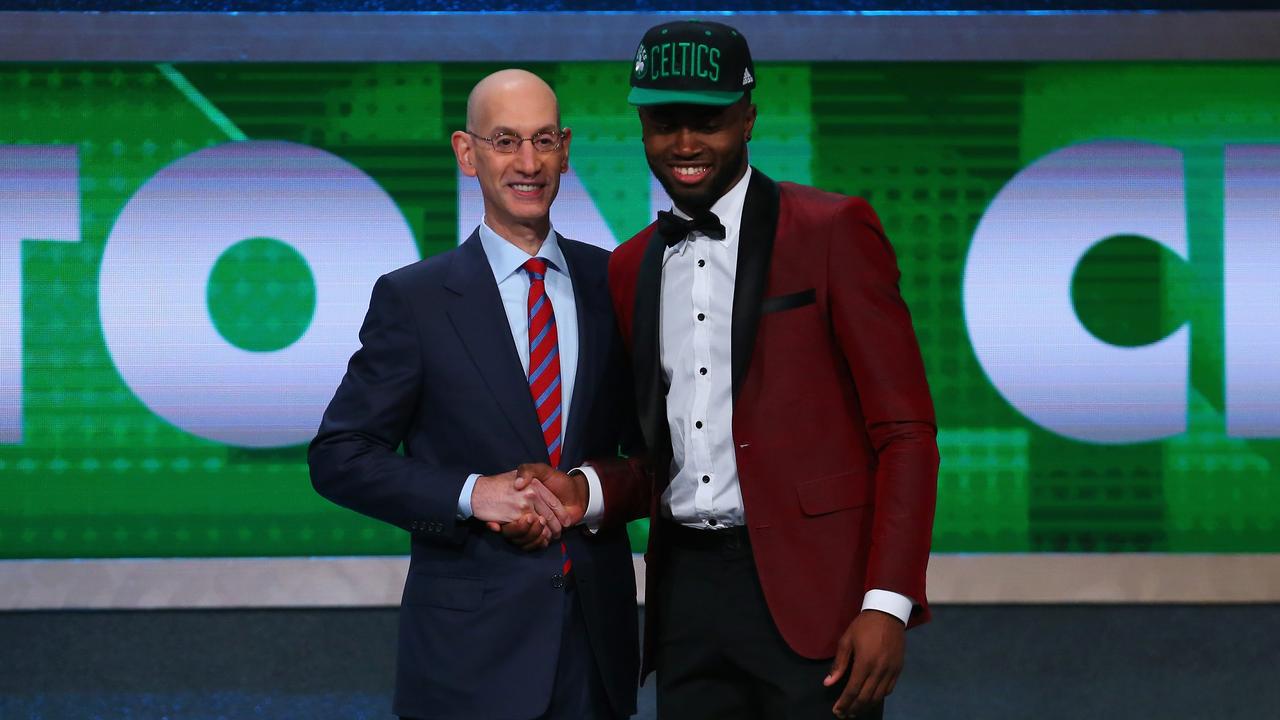 Jaylen Brown poses with Commissioner Adam Silver after being drafted third overall by the Boston Celtics in the first round of the 2016 NBA Draft. (Photo by Mike Stobe/Getty Images)